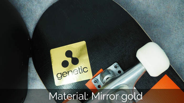 Mirror gold sticker with rounded corners and genetic design applied to skateboard