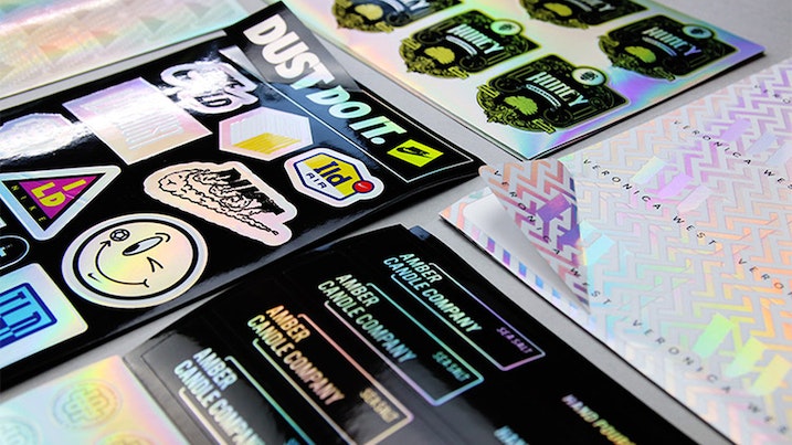 Stacks of holographic sheet labels on a table