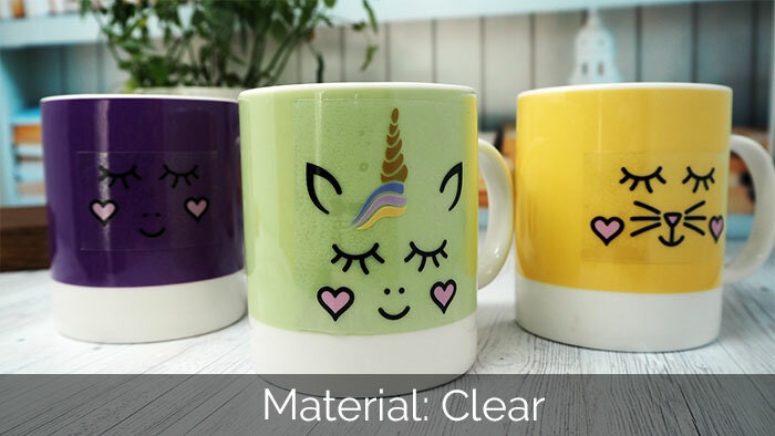 Different mug stickers printed on clear vinyl applied to three different mugs