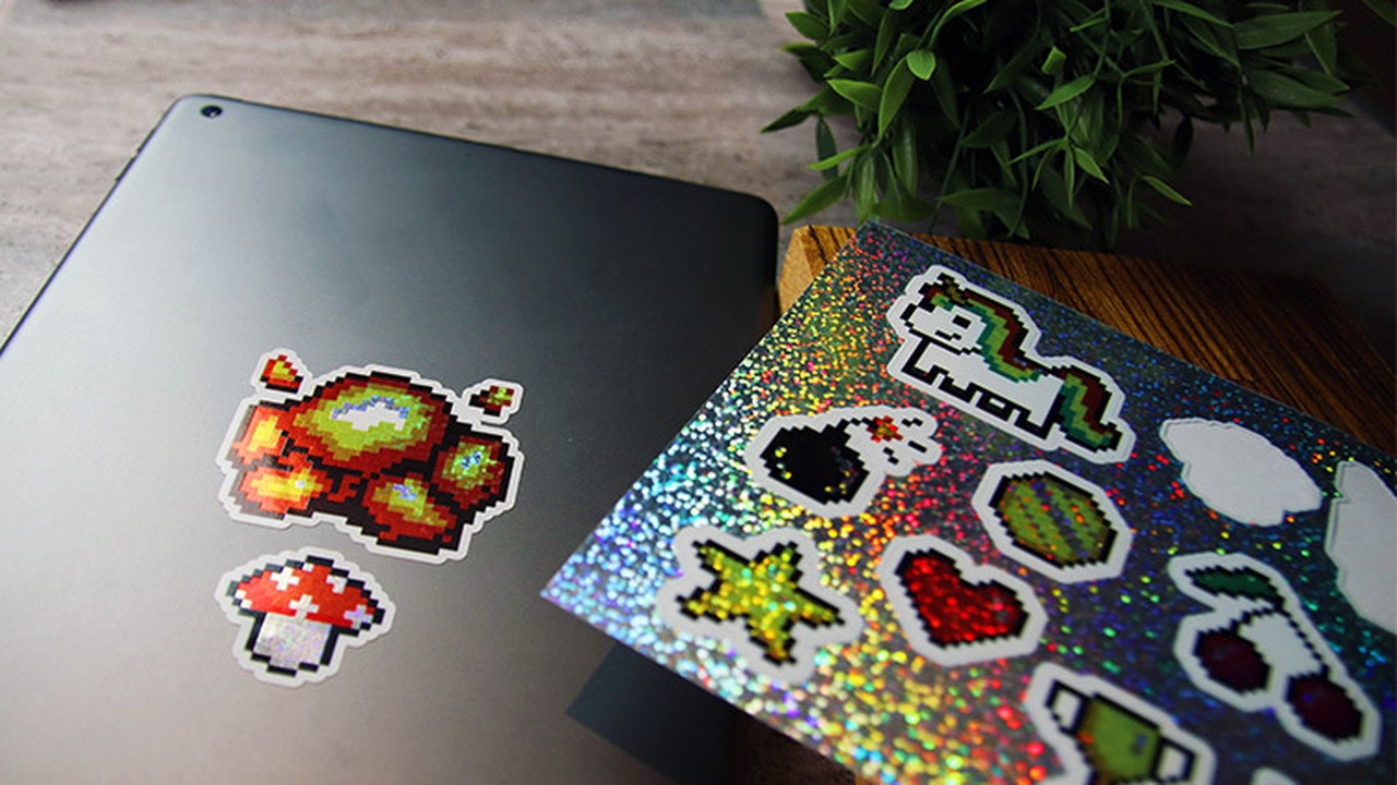 Die cut glitter sheet labels with stickers applied to an iPad