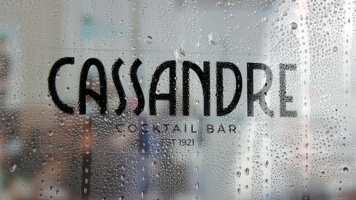 Eco-friendly front adhesive rectangle sticker with cassandre cocktail bar logo applied to a window