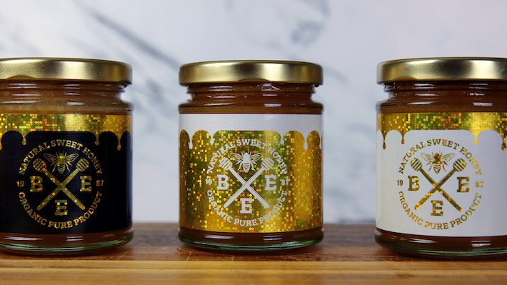 Rectangle glitter labels in different colors used as honey jar labels