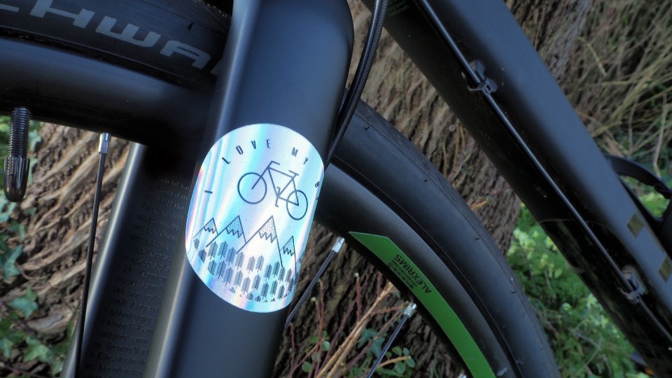 Holographic circle sticker on the frame of a bike