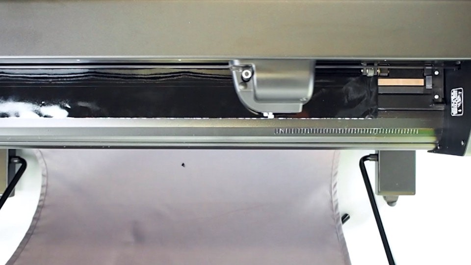 A Summa plotter cutting black vinyl to create transfer stickers
