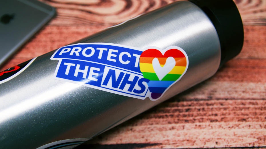 Protect the NHS white die cut sticker stuck to a water bottle