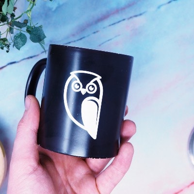 White owl transfer sticker on a mug