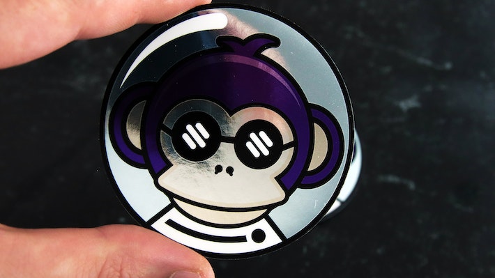 Circle mirror silver sticker with space monkey design hand held