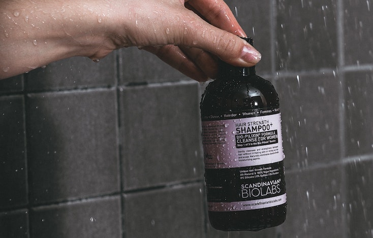 Shampoo label applied to a bottle in the shower