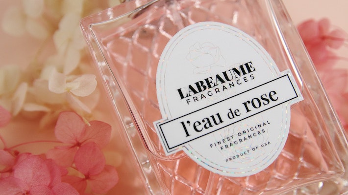 Die cut glitter sticker applied to rose scented perfume bottle